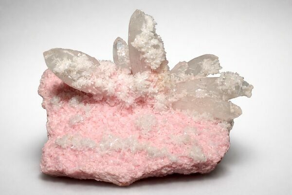 A specimen of Rhodochrosite with quartz crystals from the Cavnic mines in Romania.